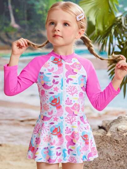 1 pieza Traje de baño de una pieza para niña. Diseño de traje de baño de una pieza con falda, patrón de dibujos animados lindo, diseño con cremallera, estilo dulce y encantador, adecuado para natación de niñas, vacaciones en la playa, parque acuático. El diseño de mangas largas y falda proporciona una buena protección de la piel, tela de alta calidad.