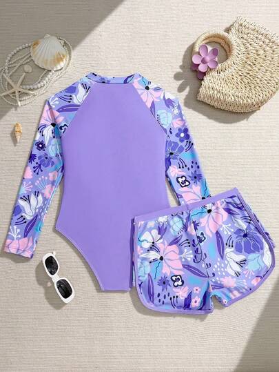 SHEIN 1 pieza Traje de baño de una pieza con shorts para adolescentes, conjunto de 2 piezas, nuevo diseño de manga larga con cremallera para chicas adolescentes. Adecuado para playa y natación en primavera/verano. Estampado de flores moradas en patchwork, diseño de moda. Cómodo, fresco y de tela.