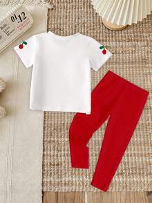 SHEIN Set de 2 piezas de camiseta con estampado gráfico de cereza, hojas y lazo, y leggings casuales para niñas pequeñas, uso cómodo para primavera, verano y otoño - Multicolor - Ver 2