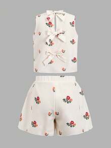 SHEIN Bộ đồ thường ngày cho bé gái tuổi teen, gồm áo hai dây hở lưng và quần short cùng họa tiết hoa nhí thắt nơ, kiểu dáng ôm sát. - Màu be - Xem 2