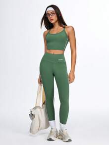 Eassivo Eassivo Women's Moss Green Strappy Crop Top, Cross‑Back Adjustable Straps, Smooth Stretch Fabric, Logo Back Detail, Yoga Top With Bra - Army Green - View 13