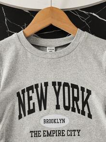 Bộ áo thun ngắn tay cổ tròn in họa tiết đơn giản dành cho bé gái tuổi teen và quần dài. - Xám - Xem 3