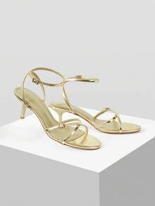 Mnmlis Sandalias de tacón de aguja con tiras cruzadas de metal para mujer - Oro claro - Ver 6