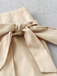 Franclia 女士卡其色梭织面料蝴蝶结高腰A字迷你裙，不规则腰线蝴蝶结装饰法式别致风格系带蝴蝶结裙摆，适合工作和约会穿着。 - 卡其色 - 查看 4