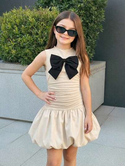 SHEIN Vestido sin mangas con cintura ceñida y dobladillo acampanado con decoración de lazo para niña preadolescente elegante