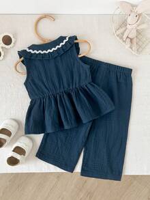 Cozy Pixies Bộ 2 món cho bé gái: áo cardigan không tay cổ bèo phối màu tương phản và quần cạp chun. - Xanh đậm - Xem 2