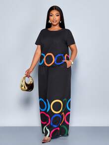 SOLERSUN 大码女装春夏时尚圆形图案定位印花圆领短袖宽松休闲上衣搭配阔腿裤两件套，适合圣帕特里克节、复活节、音乐节等场合。 - 黑色 - 查看 3