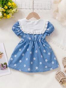Souflis Souflis 女婴优雅蝴蝶结碎花荷叶边领短袖连衣裙，夏季户外田园风。这款可爱的浅蓝色碎花连衣裙采用柔软舒适的面料制成，配有优雅的领口和精致的荷叶边，胸前饰有白色领口和蓝色蝴蝶结，并点缀着白色小碎花图案，整体风格甜美可爱，适合6个月至3岁的女婴夏季穿着。短袖连衣裙，度假连衣裙，海军蓝领连衣裙，女童连衣裙，婴儿连衣裙 - 藍色 - 查看 4