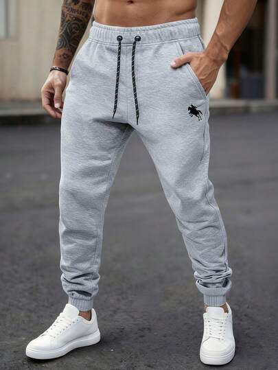 Manfinity Homme Pantalones de chándal holgados con cordón y estampado gráfico de dibujos animados para hombres