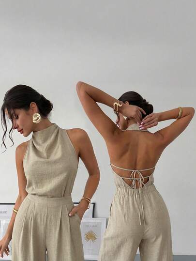 Firerie 女士优雅新款春夏亚麻质感连体裤，复古现代不对称领无袖露背蝴蝶结装饰修身黑色办公连体裤，适合音乐会、舞会和狂欢节等场合。