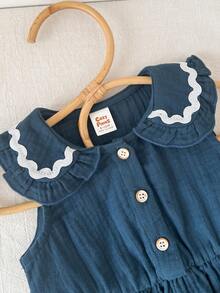 Cozy Pixies Bộ 2 món cho bé gái: áo cardigan không tay cổ bèo phối màu tương phản và quần cạp chun. - Xanh đậm - Xem 6