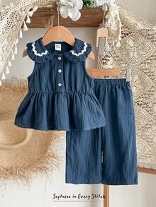 Cozy Pixies Bộ 2 món cho bé gái: áo cardigan không tay cổ bèo phối màu tương phản và quần cạp chun. - Xanh đậm - Xem 1