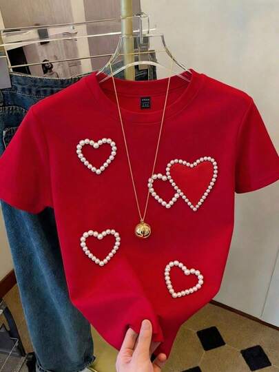 Camiseta de cuello redondo de manga corta ajustada con decoración de perlas y corazón de estilo dulce para mujer, ideal para uso diario en primavera y verano