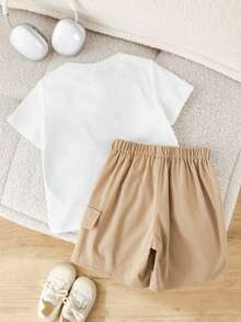 SHEIN Little Byeori Bộ 2 món gồm áo thun cổ tròn và quần short kaki dáng rộng, thích hợp cho bé trai, phù hợp mặc hàng ngày, thể thao, dã ngoại, đi học, tụ họp, lễ hội, biểu diễn và chụp ảnh. - Màu Khaki - Xem 2