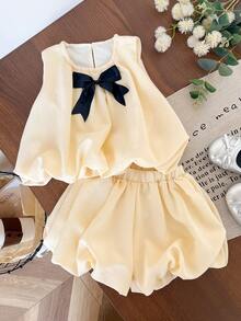 Genkimix Kids Bộ 2 món cho bé gái: Áo không tay trang trí nơ và quần short màu trơn. - Màu vàng - Xem 1