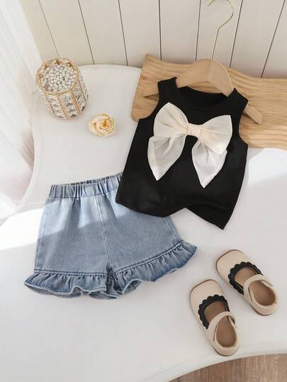SHEIN Baby Girls' Summer Vest With Bow Tie And Denim Ruffle Shorts Set 2pcs/Set Baby Girl Round Neck Short Sleeve Bow Printed T-Shirt And Embroidered Bow Denim Shorts Set Suitable For Spring/Summer Baby Girl Clothes, Toddler Girl Clothes Baby Girl Clothes Sets Summer Infant Girl Short Sleeve Outfits Baby Girl Rainbow Outfit Toddler Sets Summer Baby Casual Sets