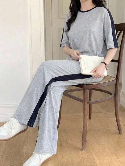 2件套少女休闲运动家居服纯色拼接宽松圆领短袖T恤和阔腿裤返校套装，灰色和藏蓝色针织圆领宽松落肩休闲套装，简约休闲街头运动休闲两件套，返校套装，可爱假日家庭户外春季野餐日常休闲两件套，适合各种场合