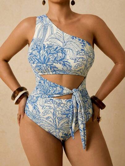 Travachic Traje de baño de una pieza con estampado de plantas tropicales verdes y cortes con lazo delantero, para uso casual de vacaciones en tallas grandes