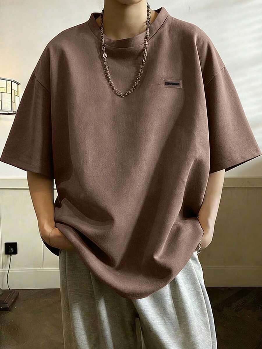 Claim Dot Camiseta de tirantes holgada y casual de unicolor, cuello redondo y mangas cortas para hombres de talla grande - Café integral - Ver 1