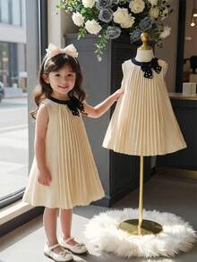 Đầm chữ A màu xanh nhạt xếp ly cổ nơ đính hạt cho bé gái, thích hợp cho các dịp thường nhật, đi nghỉ mát và mặc hàng ngày thanh lịch. - Nhiều màu - Xem 1