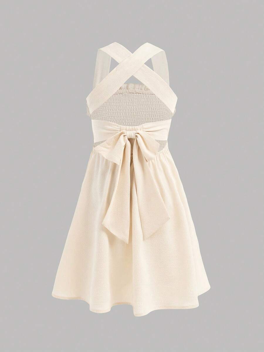 SHEIN Tween Girl Hollow Out Bowknot Decor Criss-Cross Strap Casual Sleeveless Dress Beige Dress For Girl Cream Dress Dress With Bow, Tween Girl - Apricot - View 1