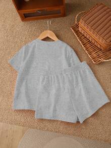 Bộ đồ đôi áo tay ngắn và quần short tối giản phong cách vintage dành cho bé gái tuổi teen, thích hợp cho mùa hè, với họa tiết nơ cổ và da báo. - Màu Xám nhạt - Xem 5