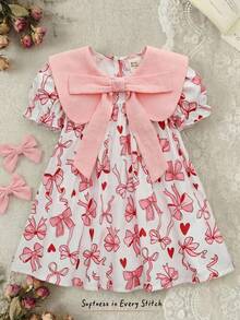 Cozy Pixies Đầm bé gái in hoa, cổ tròn, tay phồng, thắt eo, nơ to. - Nhiều màu - Xem 2