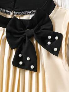 Đầm chữ A màu xanh nhạt xếp ly cổ nơ đính hạt cho bé gái, thích hợp cho các dịp thường nhật, đi nghỉ mát và mặc hàng ngày thanh lịch. - Nhiều màu - Xem 5