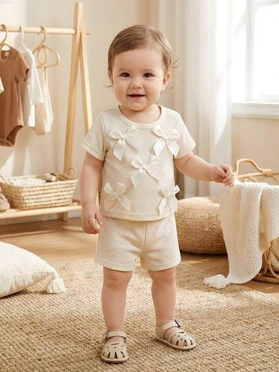 SHEIN Baby Girls Casual Fashion Daily Round Neck Short Sleeve Cropped Bow Decor Pink T-Shirt And Elastic Waist Shorts 2-Piece Set