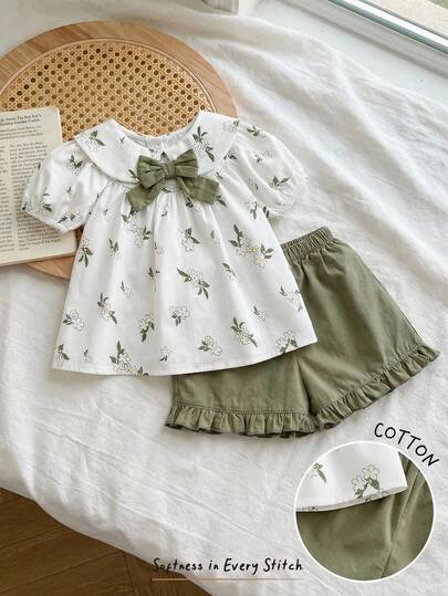 Cozy Pixies 2 件女婴花卉图案彼得潘领泡泡袖上衣和纯色松紧腰短裤套装