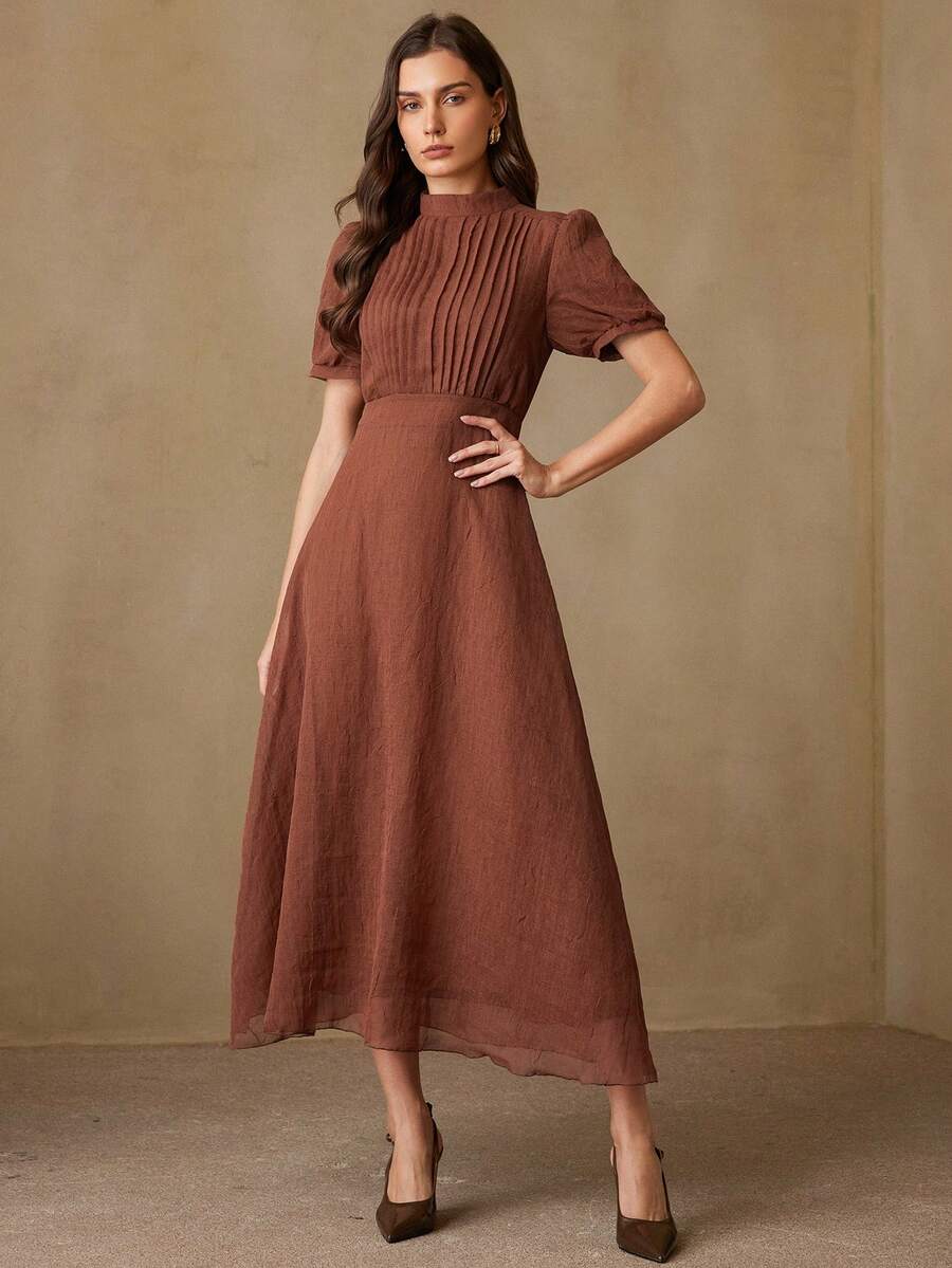 Revavyn Elegante vestido de manga larga para mujeres con cuello redondo, frente plisado, cintura ceñida y bajo acampanado, con sensación de lino, ideal para ir al trabajo y de vacaciones - Óxido marrón - Ver 1