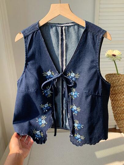 Comfortcana Women's Floral Embroidery Front Tie Denim Vest For Vacation Summer Tops Spring Clothes Women Easter Top St Patrick's Day Women  Beach Outfits For Women  Tops For Going Out Vacation Outfits Women Casual Blouse For Women Blue Top Womens Embroidered Denim Vest Sleeveless V Neck Tie Front Scalloped Hem Tank Top