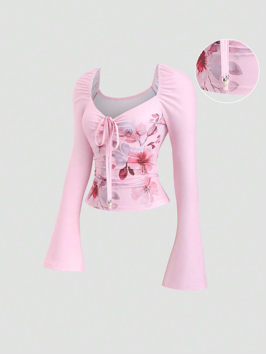 Sweetra Áo thun nữ màu hồng, thích hợp cho Halloween, Lễ Tạ ơn, Năm mới, dự tiệc, đi làm, mặc hàng ngày, du lịch, nghỉ mát. Áo có họa tiết in, nơ đính hạt, thiết kế nhún bèo, dễ thương và tinh nghịch, ôm eo, tay dài. - Hồng - Xem 1