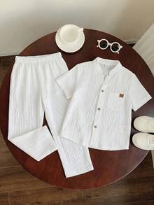 SHEIN 男童休闲运动套装，包含一件立领衬衫和一条裤子，采用纹理面料，适合儿童穿着，是返校季的理想选择。套装也适合生日派对、晚宴、演出、婚礼、洗礼、开幕式等场合，日常穿着舒适，适合上学、旅行、运动，尤其适合春夏季节。 - 彩色 - 查看 7