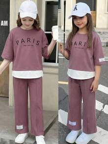 SHEIN Bộ đồ 2 món dành cho bé gái tuổi teen: Áo thun cổ tròn màu tím, dáng rộng, phối màu tương phản, in chữ tiếng Anh và nhãn dệt, tay lỡ 3/4, ống rộng, phong cách tối giản thường ngày kiểu học sinh. - Màu tím - Xem 1