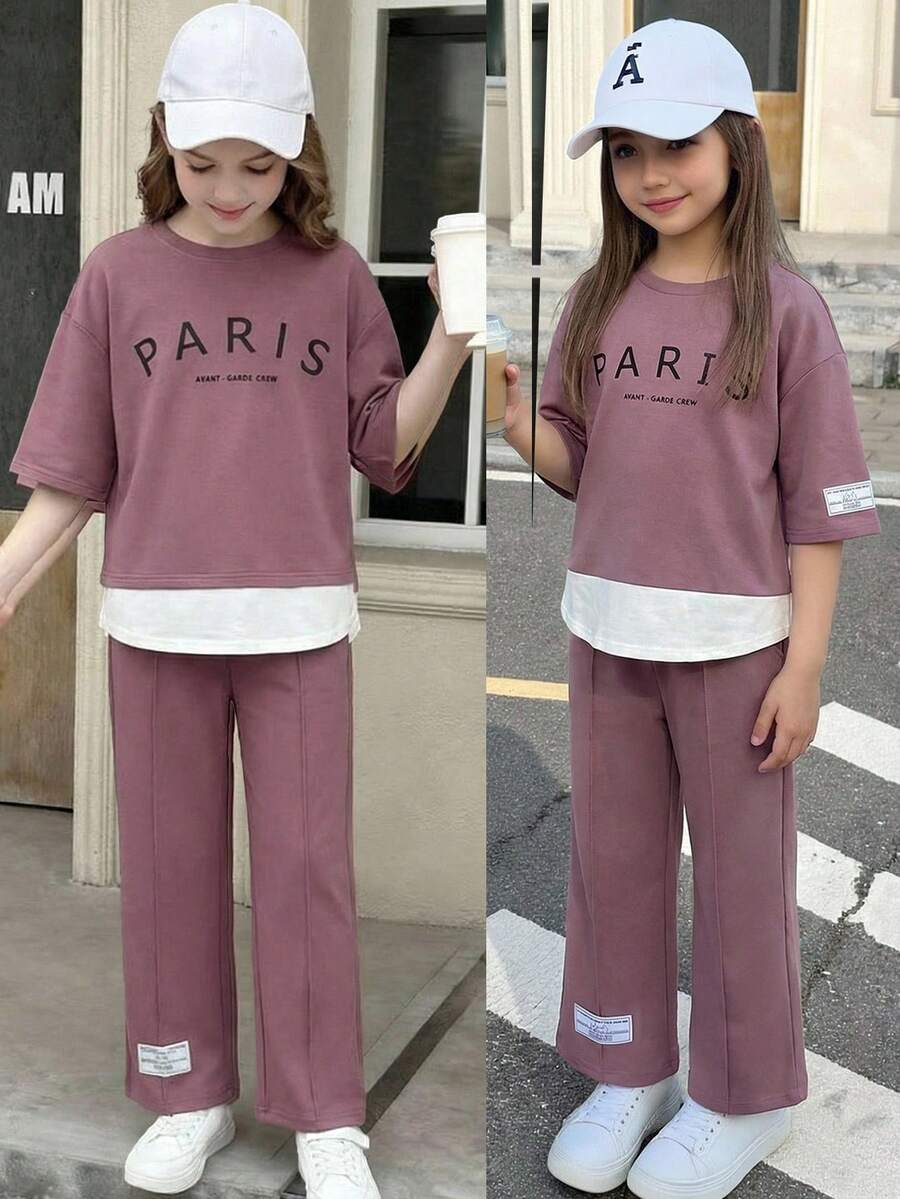 SHEIN Bộ đồ 2 món dành cho bé gái tuổi teen: Áo thun cổ tròn màu tím, dáng rộng, phối màu tương phản, in chữ tiếng Anh và nhãn dệt, tay lỡ 3/4, ống rộng, phong cách tối giản thường ngày kiểu học sinh. - Màu tím - Xem 1