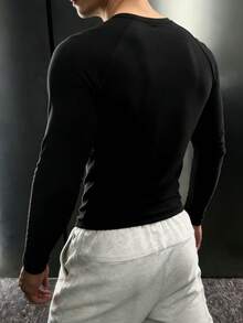 GymBeat Camiseta Esportiva Manga Longa Raglan com Impressão de Barra Olímpica para Homens - Preto - Visão 2