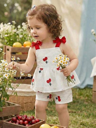 SHEIN 2pcs/Set Baby Girls Cherry Embroidery White Camisole Top With Red Bow Decor + Elastic Waist A-Line Shorts Casual Cute Outfit, Suitable For Summer Daily Wear Or Outing