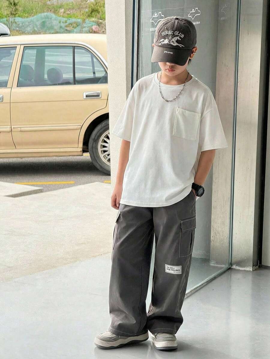 2pcs Tween Boy Loose Fit Round Neck Short Sleeve T-Shirt With Cargo Pocket & Contrast Color Pants Set, Casual, Sports, Vacation, School, Party, Fashion Versatile, Spring/Summer - White - View 1