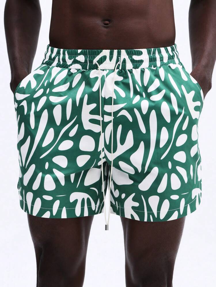 Calções de praia com estampa de folhas tropicais