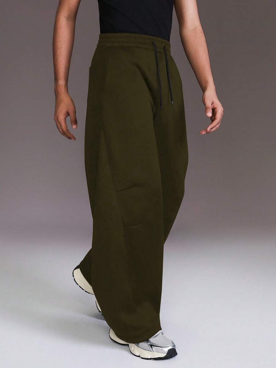 STYNVO Men's Casual Sports Drawstring Waist Loose Wide Leg Sweatpants, Minimalist Solid Color, Versatile For Daily Commute Olive Green Pants Army Green Pants Wide Pants Oversized Pants Loose Pants - Army Green - View 1