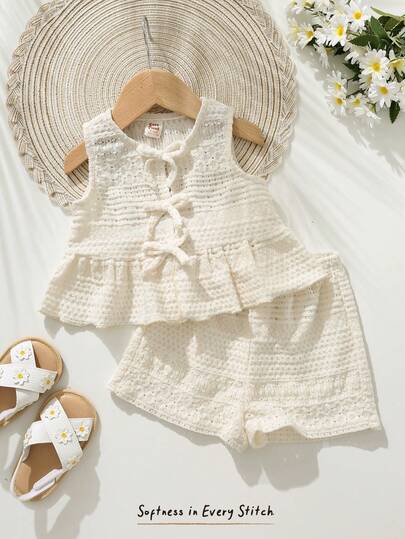 Cozy Pixies Bộ 2 món cho bé gái: áo cardigan dệt kim mềm mại màu trơn cổ tròn không tay và quần short cạp chun.