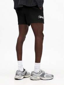 SUMWON Quần short nam có dây rút, viền trắng và in logo, kiểu dáng thường ngày mùa hè, cạp chun co giãn. - màu đen - Xem 2