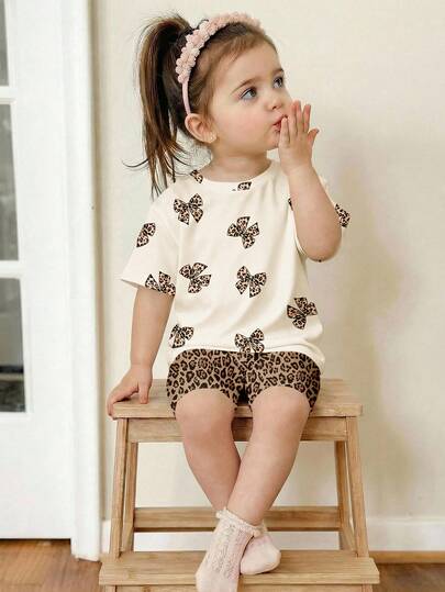 SHEIN Vintage Leopard Bow Print, Baby Girl Casual Minimalist Round Neck Short Sleeve Loose T-Shirt And Bike Shorts 2-Piece Set, Suitable For Spring/Summer Daily, Street, Outing, Home, Vacation Wear