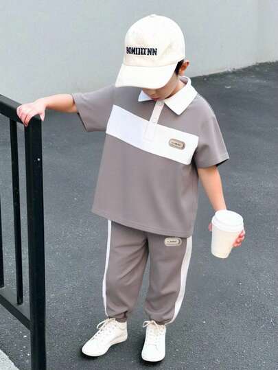 SHEIN Genkimix Kids 2pcs/Set Young Boy Casual Polo Shirt Set, Top With Contrast Panels And Woven Label Decor, Pants With Color Block And Tapered Leg Design, Comfortable Fabric, Suitable For Summer And Autumn