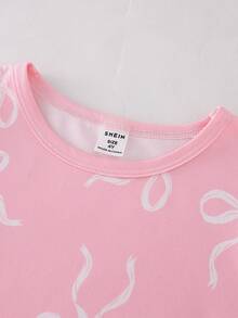 Bộ 2 món gồm váy và bộ đồ ngủ ngắn tay màu hồng cổ tròn, chất liệu mềm mại, thoải mái cho bé gái, có nơ trang trí. - Màu Hồng baby - Xem 4