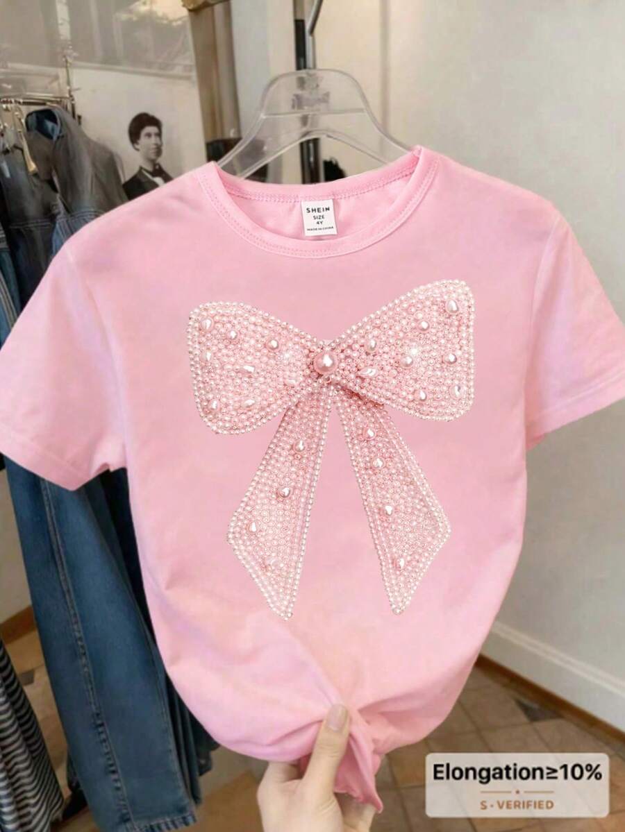 春夏秋季少女休闲时尚创意个性清新别致仿珍珠蝴蝶结装饰印花舒适基础款粉色短款T恤,温暖舒适的夏秋款式,适合春夏秋季穿着。 - 粉色 - 查看 1
