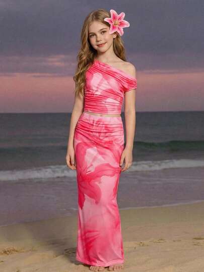 SHEIN Conjunto de 2 piezas elegante para vacaciones con camiseta de manga corta asimétrica y falda midi estampada para niña preadolescente