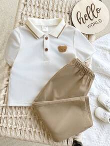 这款两件套包括一件柔软的圆领针织Polo衫，上面印有卡通熊图案，以及一条松紧腰长裤。适合生日派对、晚宴、演出、婚礼、洗礼、开幕式、日常穿着、上学、旅行以及春夏季节穿着。 - 白色 - 查看 5