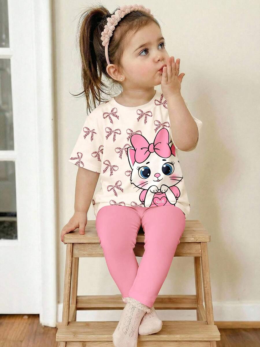 SHEIN Bộ áo thun tay ngắn cổ tròn dáng rộng màu trắng kem và hồng kem, in hình mèo dễ thương, kèm quần legging cho bé gái, kiểu dáng tối giản, mềm mại, thoải mái, thích hợp mặc hàng ngày vào mùa xuân/hè, phong cách đường phố, đi chơi, ở nhà, đi nghỉ mát. - Nhiều màu - Xem 1
